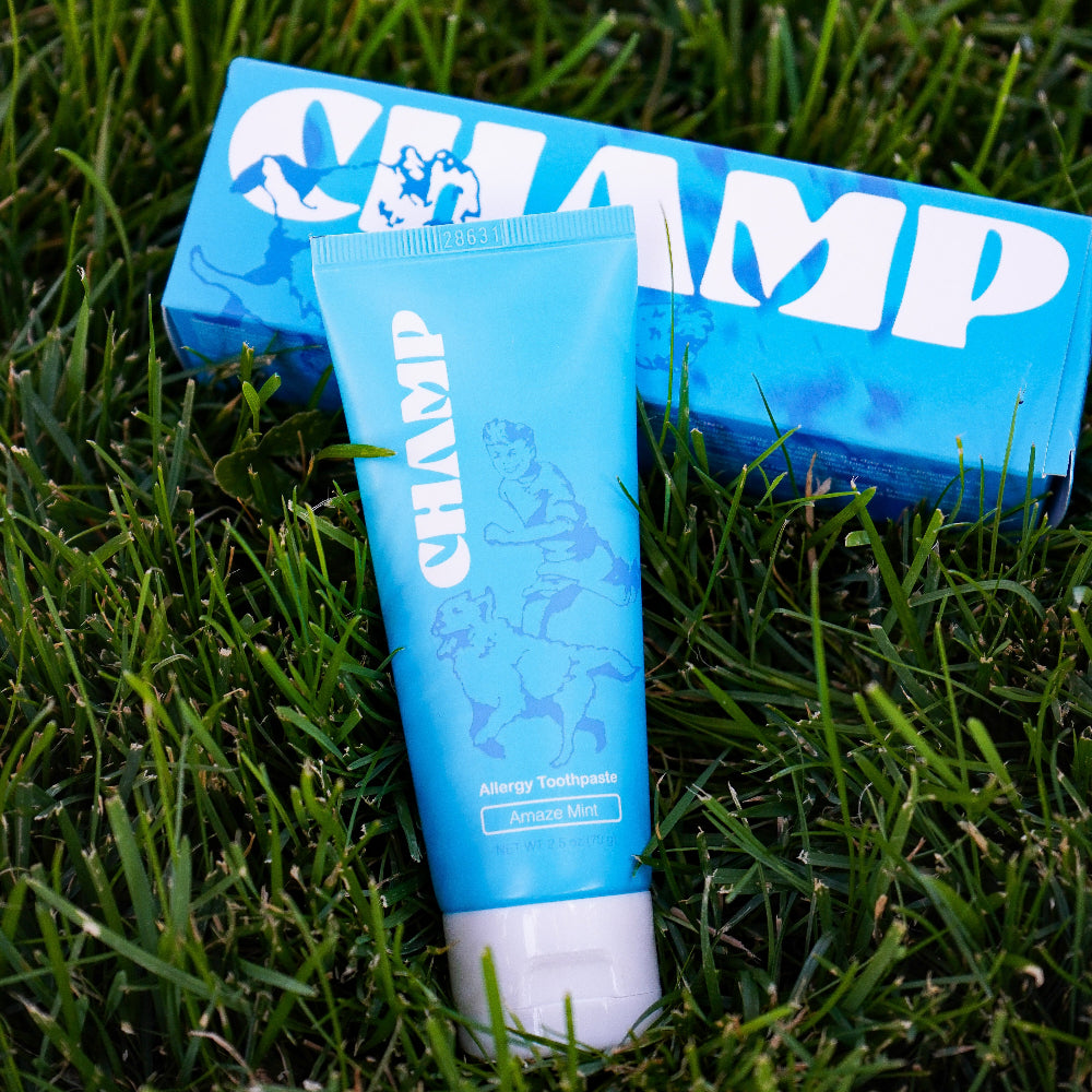 Blue 'CHAMP' tube and box on grass